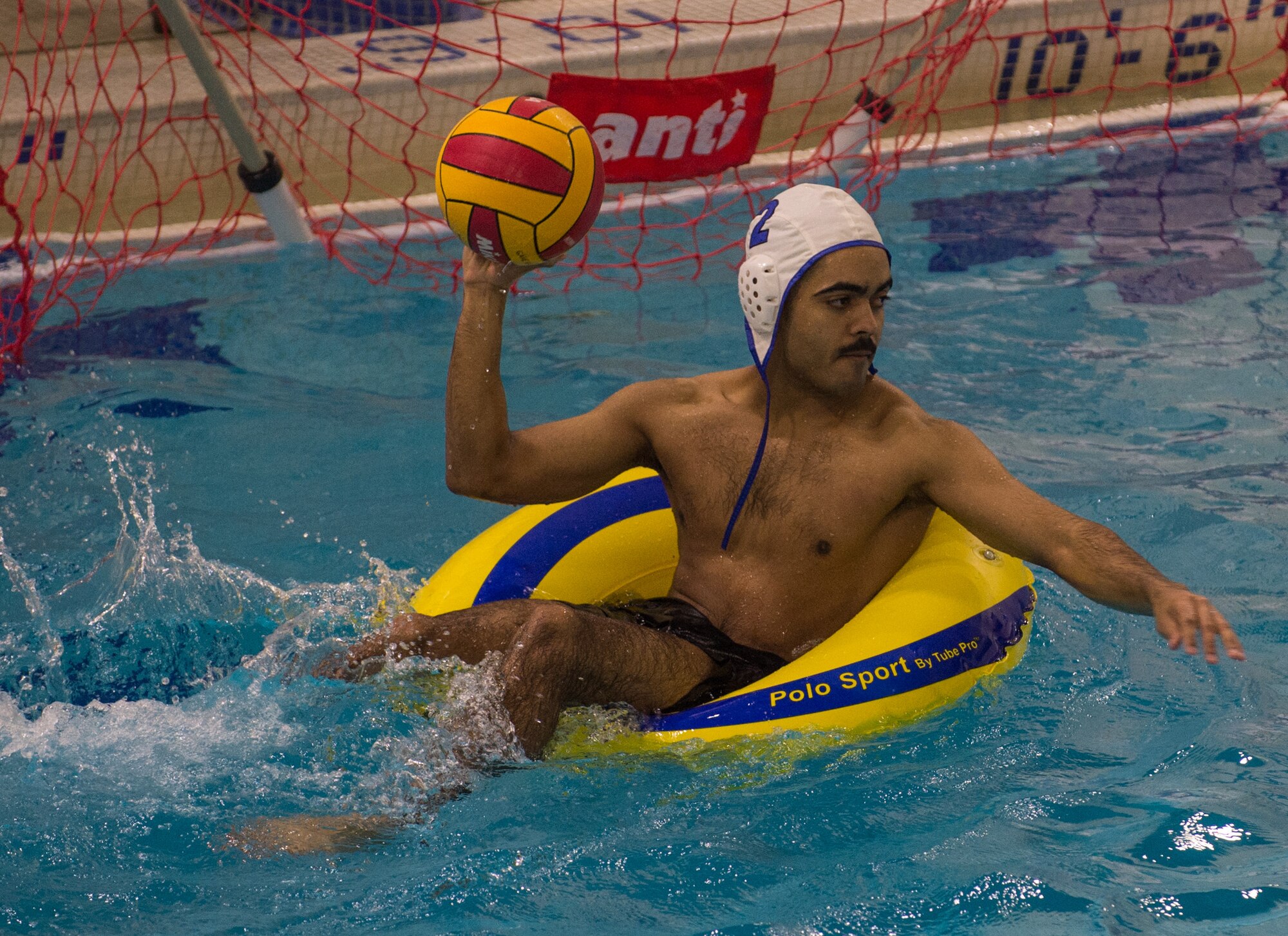 Military members and affiliates participate in an intramural game of water polo on inner tubes at the Buckner Physical Fitness Center on Joint Base Elmendorf-Richardson, Alaska, April 12, 2018. The fitness center offers a total of 18 intramural sports throughout the year, open to military members, family members, Department of Defense civilians and affiliates 18 years and older.