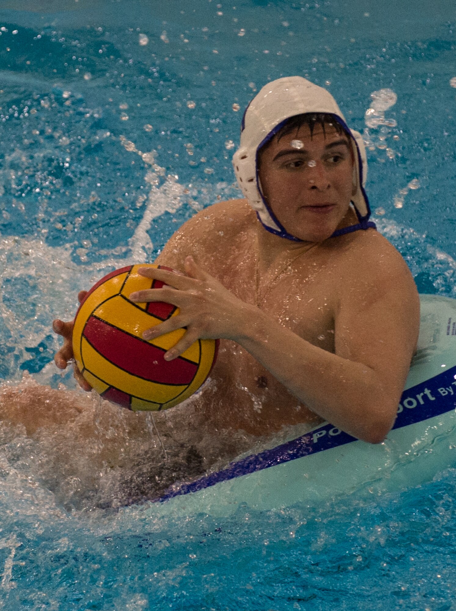 Military members and affiliates participate in an intramural game of water polo on inner tubes at the Buckner Physical Fitness Center on Joint Base Elmendorf-Richardson, Alaska, April 12, 2018. The fitness center offers a total of 18 intramural sports throughout the year, open to military members, family members, Department of Defense civilians and affiliates 18 years and older.