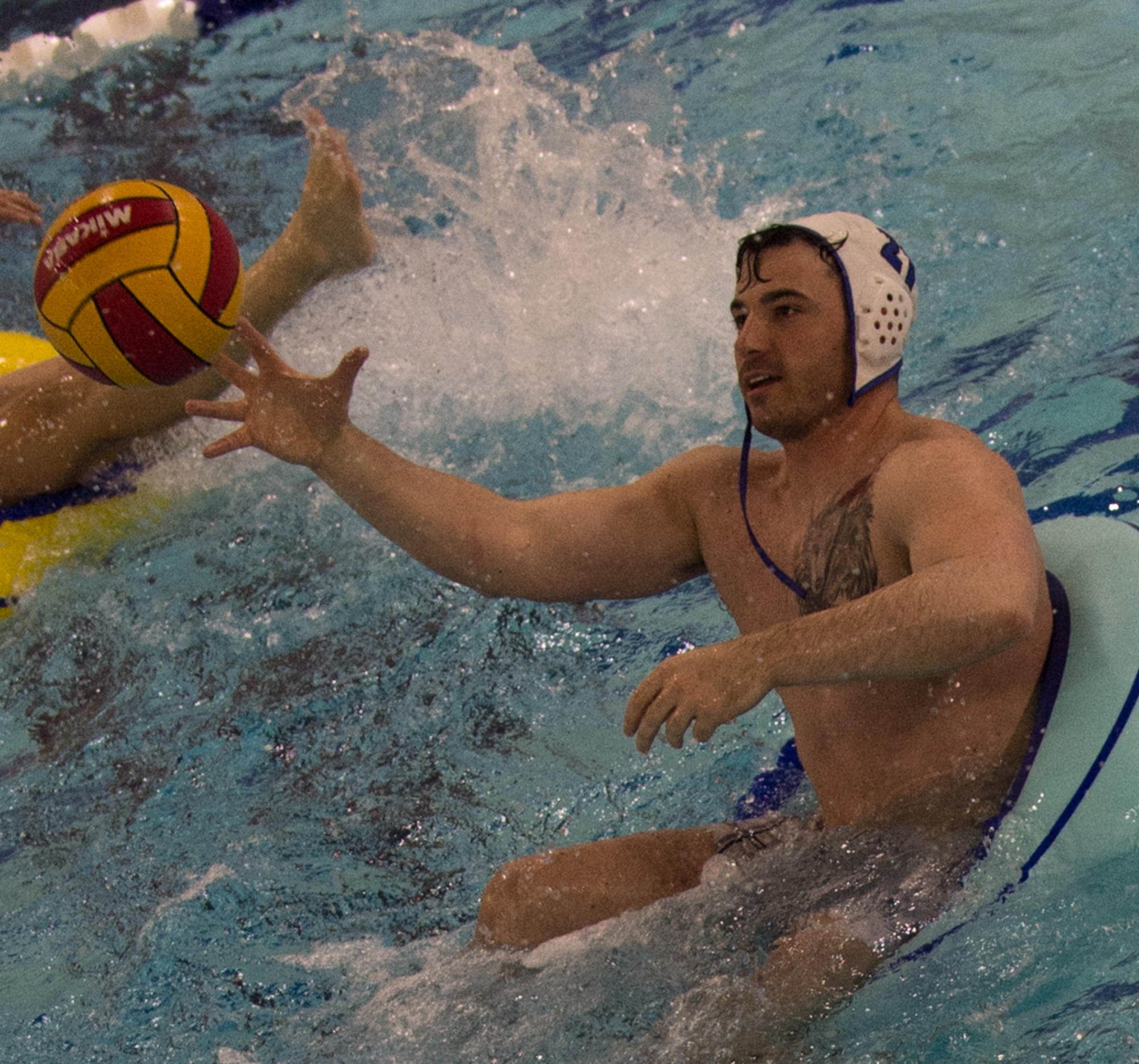 Military members and affiliates participate in an intramural game of water polo on inner tubes at the Buckner Physical Fitness Center on Joint Base Elmendorf-Richardson, Alaska, April 12, 2018. The fitness center offers a total of 18 intramural sports throughout the year, open to military members, family members, Department of Defense civilians and affiliates 18 years and older.