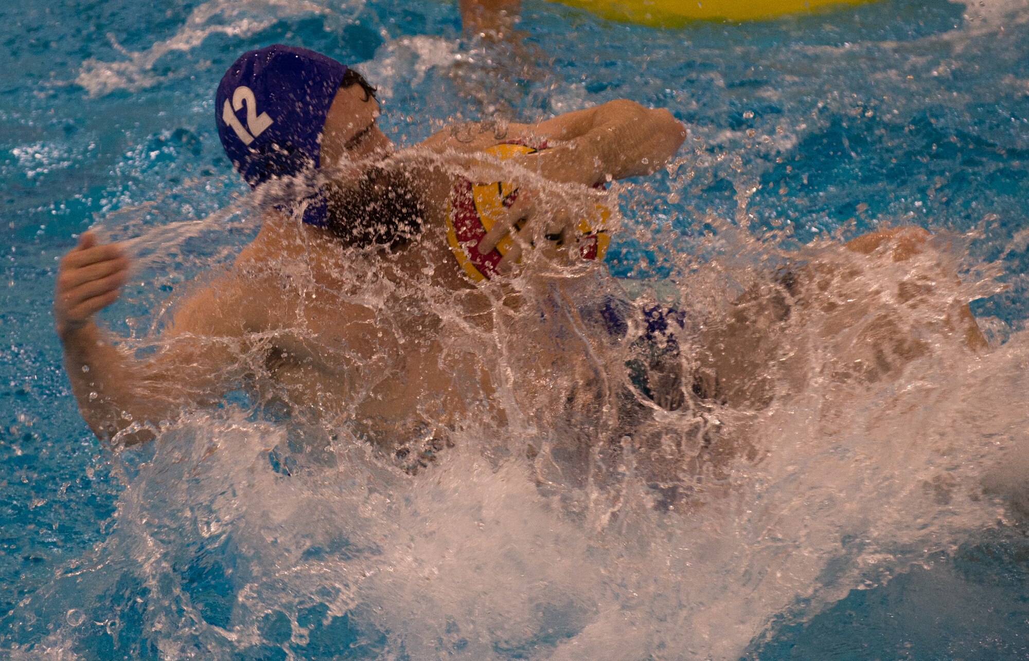 Military members and affiliates participate in an intramural game of water polo on inner tubes at the Buckner Physical Fitness Center on Joint Base Elmendorf-Richardson, Alaska, April 12, 2018. The fitness center offers a total of 18 intramural sports throughout the year, open to military members, family members, Department of Defense civilians and affiliates 18 years and older.