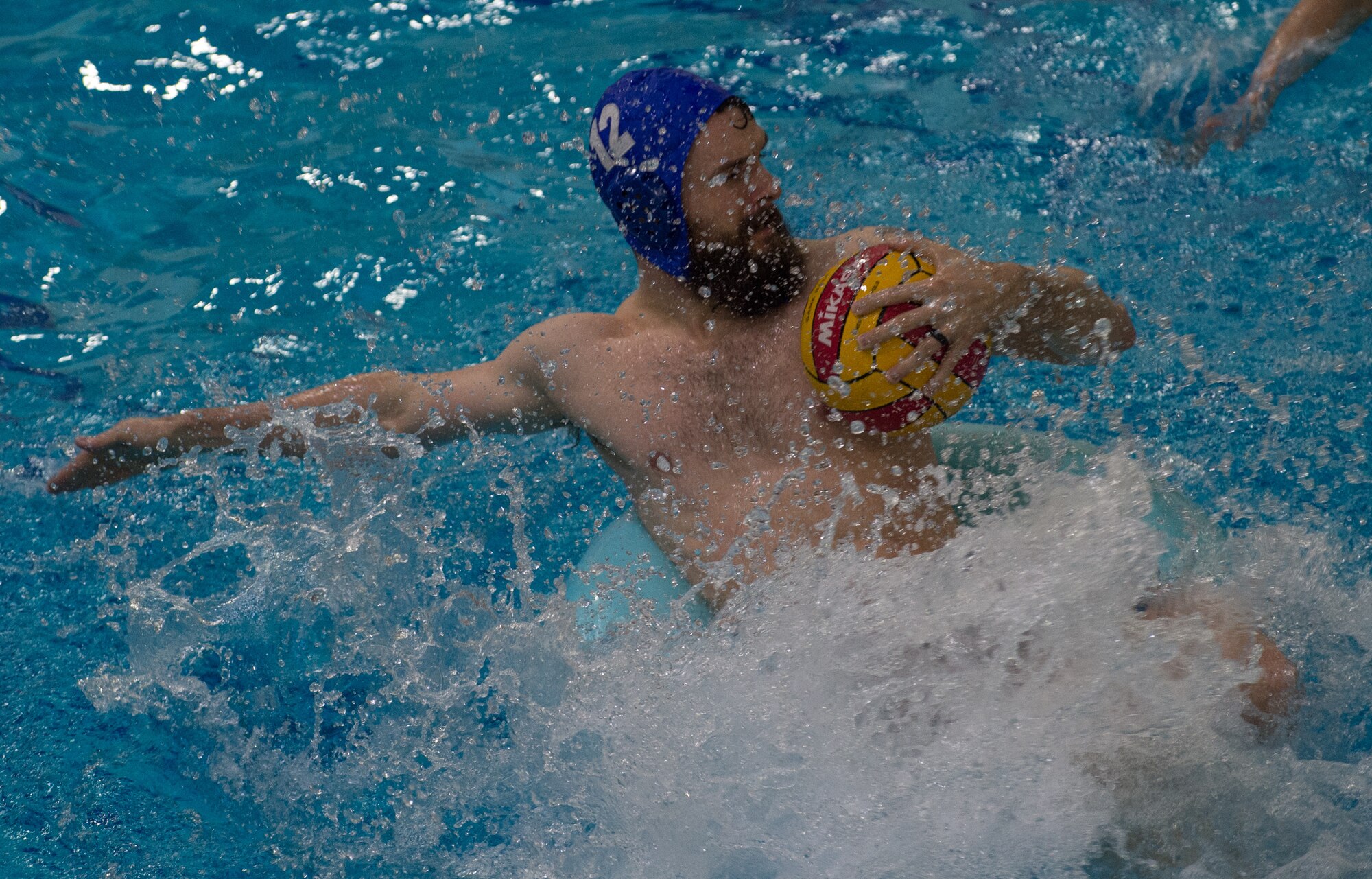 Military members and affiliates participate in an intramural game of water polo on inner tubes at the Buckner Physical Fitness Center on Joint Base Elmendorf-Richardson, Alaska, April 12, 2018. The fitness center offers a total of 18 intramural sports throughout the year, open to military members, family members, Department of Defense civilians and affiliates 18 years and older.