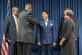 Family members of Joyce Gordon, state judge advocate for Headquarters, Kentucky Air National Guard, pin colonel’s rank insignia to her uniform during a promotion ceremony April 14, 2018, at the Kentucky Air National Guard Base in Louisville, Ky