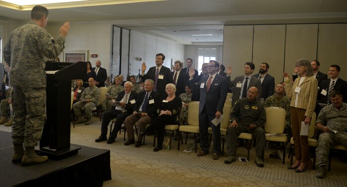 The new Honorary Commanders of Joint Base Charleston take the oath of office at the Air Base Club April 13, 2018.