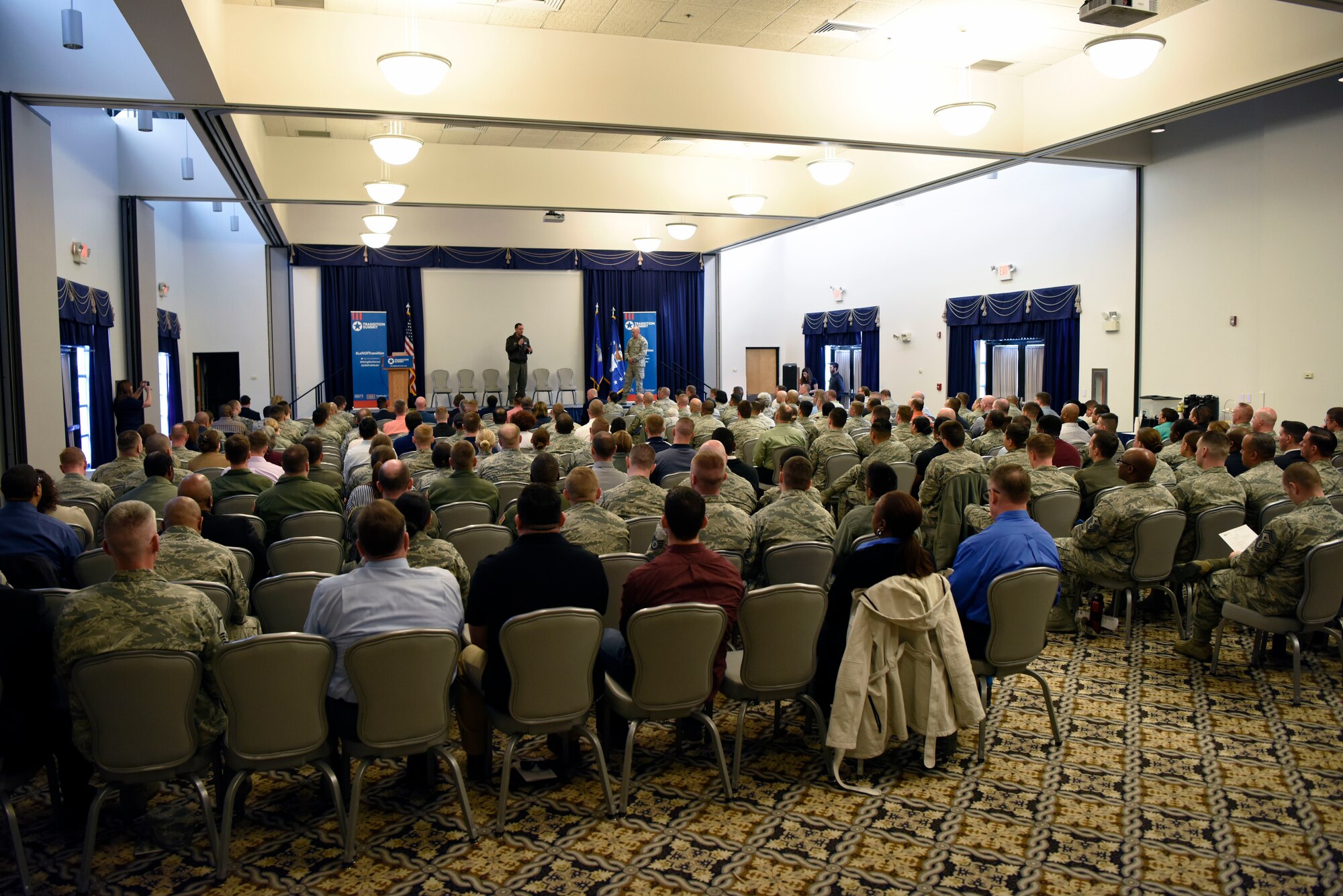 Col. Ethan Griffin, 436th Airlift Wing commander, kicks off the Hiring Our Heroes Military Transition Summit April 12, 2018, at Dover Air Force Base, Del. The event was open to all active duty service members, reservists, military spouses and veterans. (U.S. Air Force photo by Airman 1st Class Zoe M. Wockenfuss)