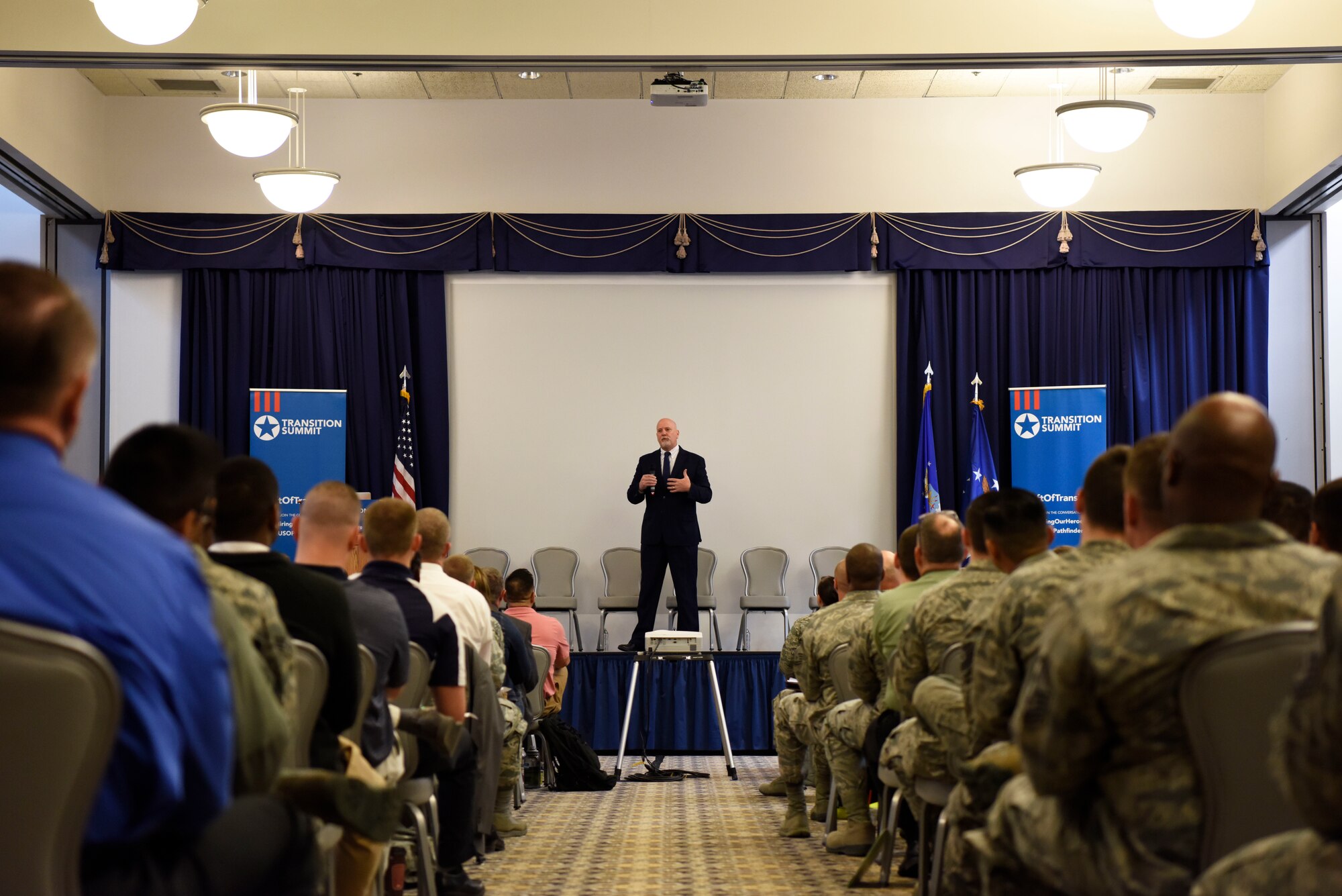 John Fedrigo, Director of Air Force Review Boards, Office of the Assistant Secretary of the Air Force for Manpower and Reserve Affairs, gave opening remarks during the Hiring Our Heroes Military Transition Summit April 12, 2018, at Dover Air Force Base, Del. Fedrigo spoke about the benefits of serving in the military when it comes time to look for a job in the civilian sector. (U.S. Air Force photo by Airman 1st Class Zoe M. Wockenfuss)
