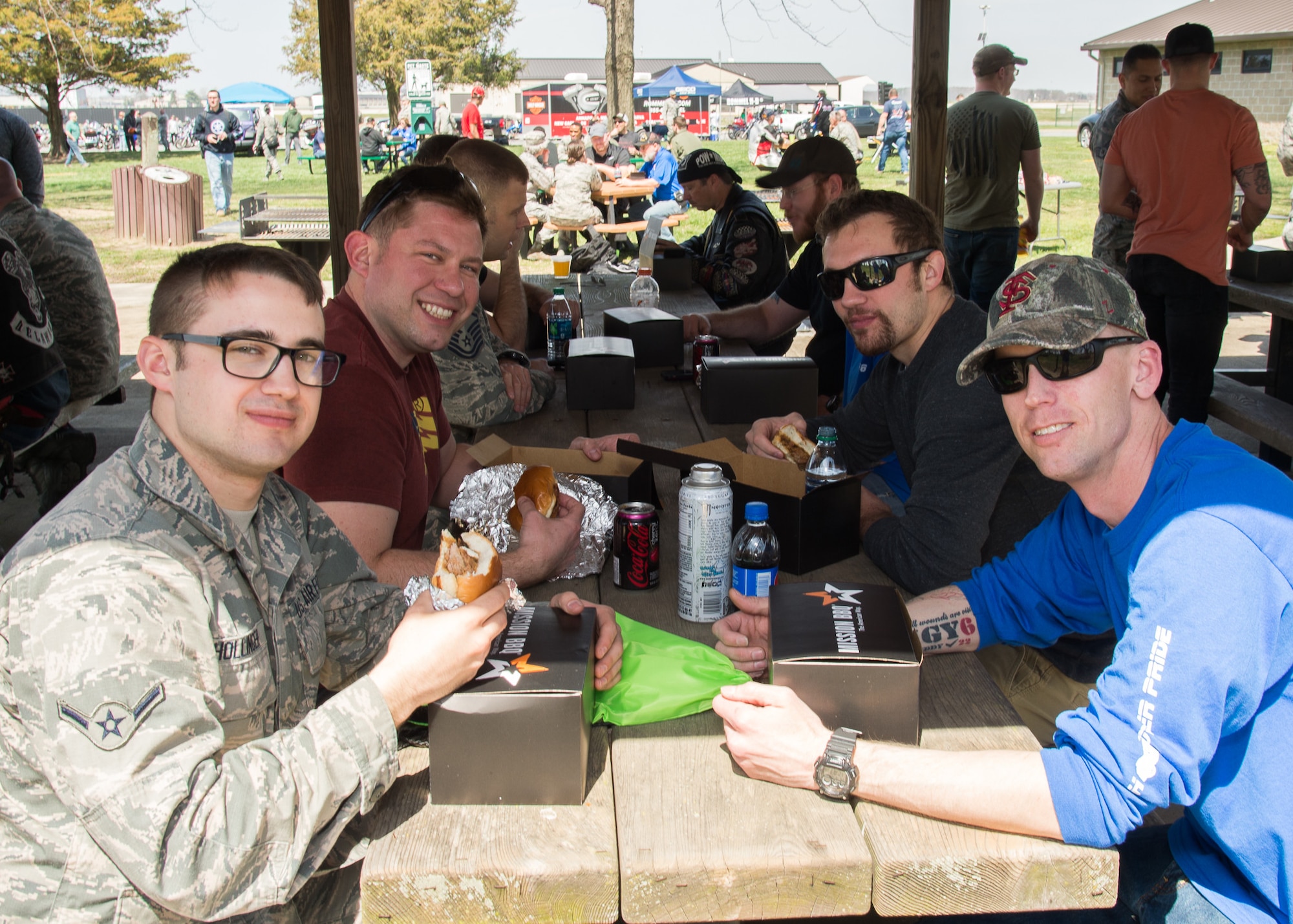 Attendees enjoy a free lunch during Motorcycle Safety Day April 13, 2018, at Dover Air Force Base, Del. The local Mission BBQ restaurant donated 175 boxed lunches and the Dover Air Force Base Chaplain Corps provided free drinks and snacks. (U.S. Air Force photo by Mauricio Campino)
