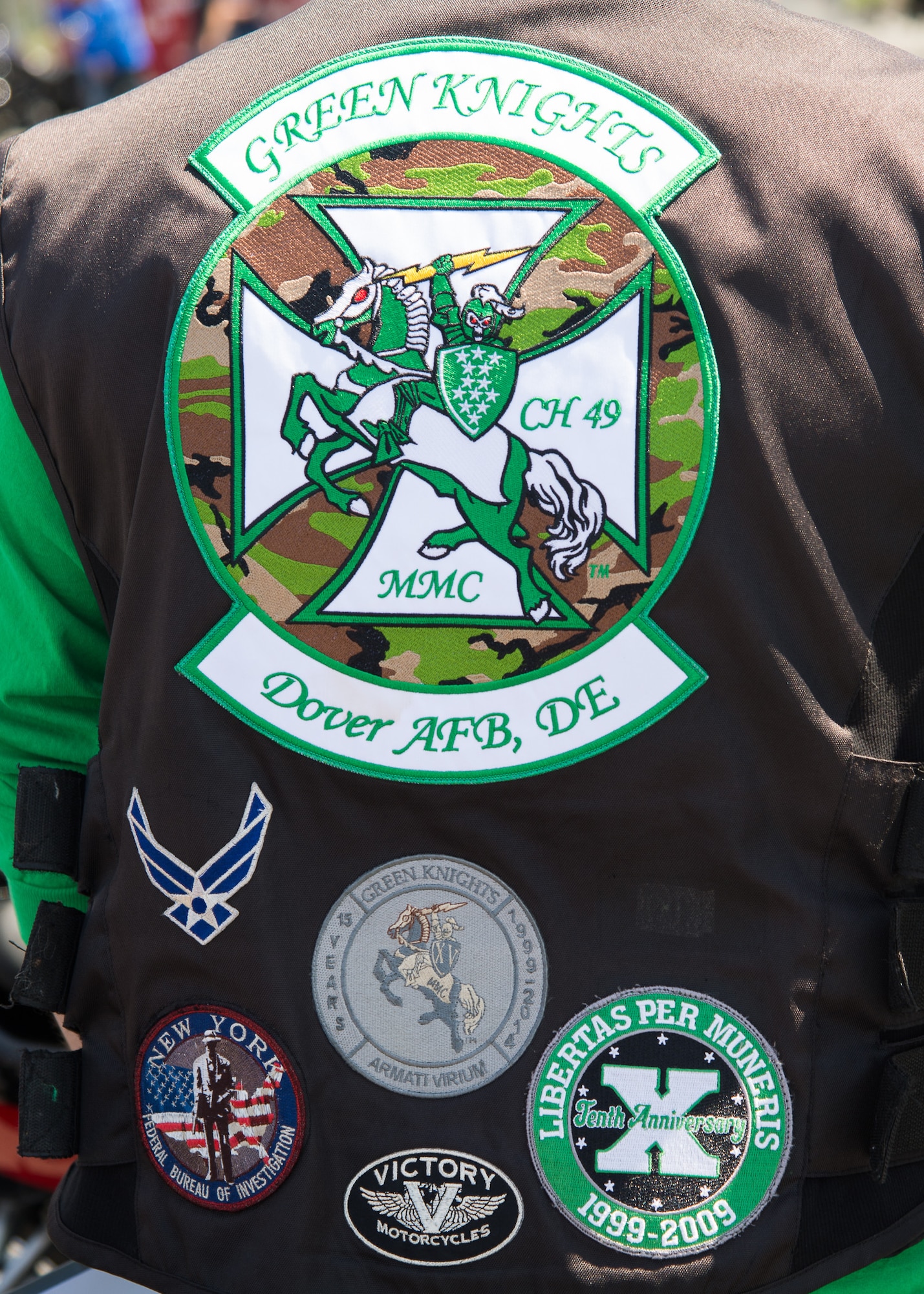 Stylized patches cover a motorcycle vest belonging to Staff Sgt. Zach Fannin, 9th Airlift Squadron C-5M Super Galaxy loadmaster and president of the Green Knights Motorcycle Club Chapter 49, at the Motorcycle Safety Day April 13, 2018, at Dover Air Force Base, Del. The Green Knights are one of the sponsors for the annual event. (U.S. Air Force photo by Mauricio Campino)