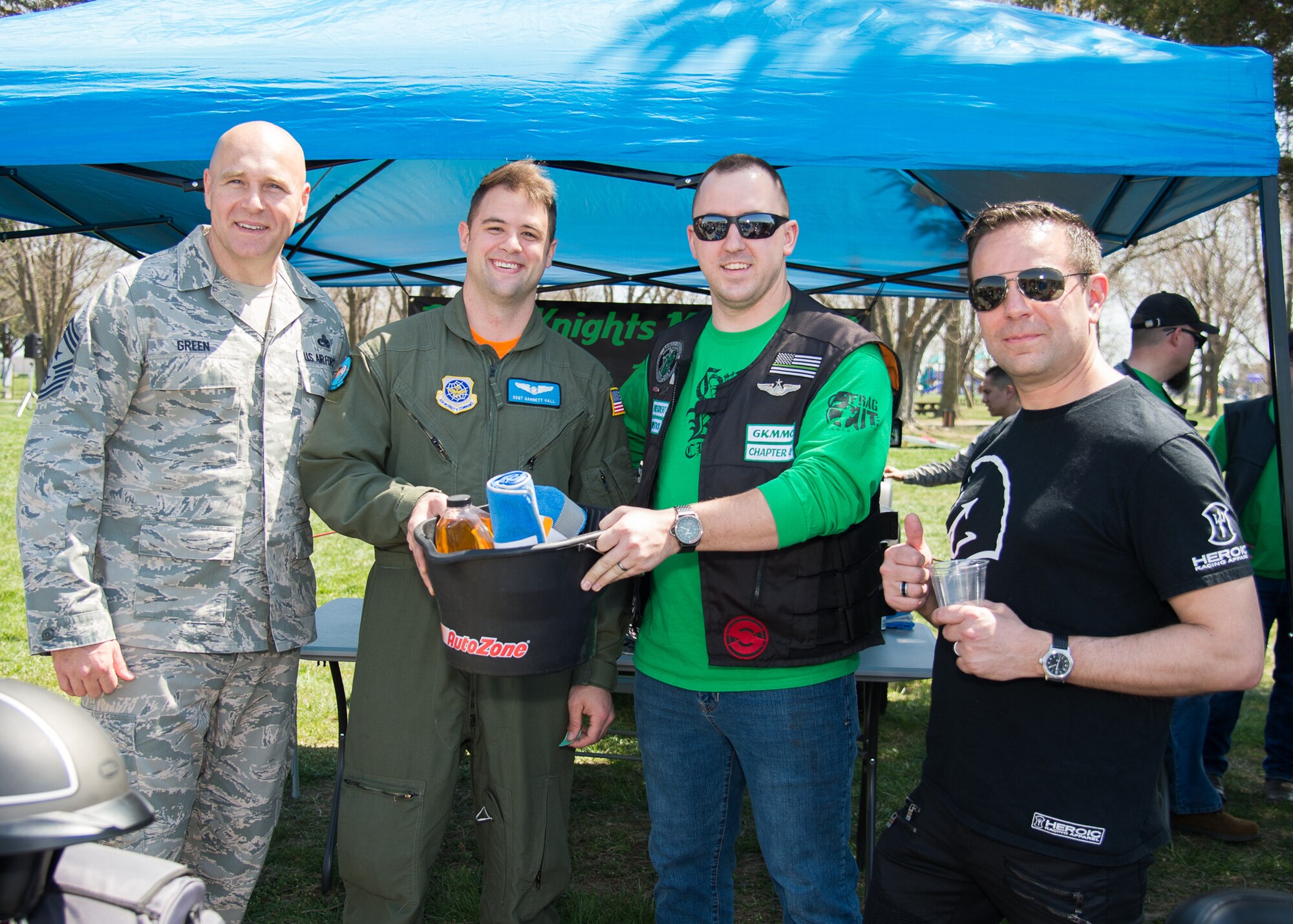Judges present the award for “dirtiest bike” to Staff Sgt. Garrett Hall during Motorcycle Safety Day April 13, 2018, at Dover Air Force Base, Del. Hall claimed he has only cleaned his motorcycle twice in eight years. (U.S. Air Force photo by Mauricio Campino)