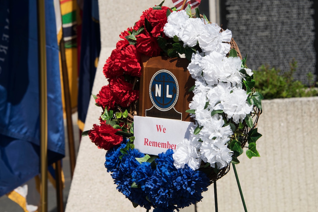 A wreath of flowers is displayed at the ceremony.