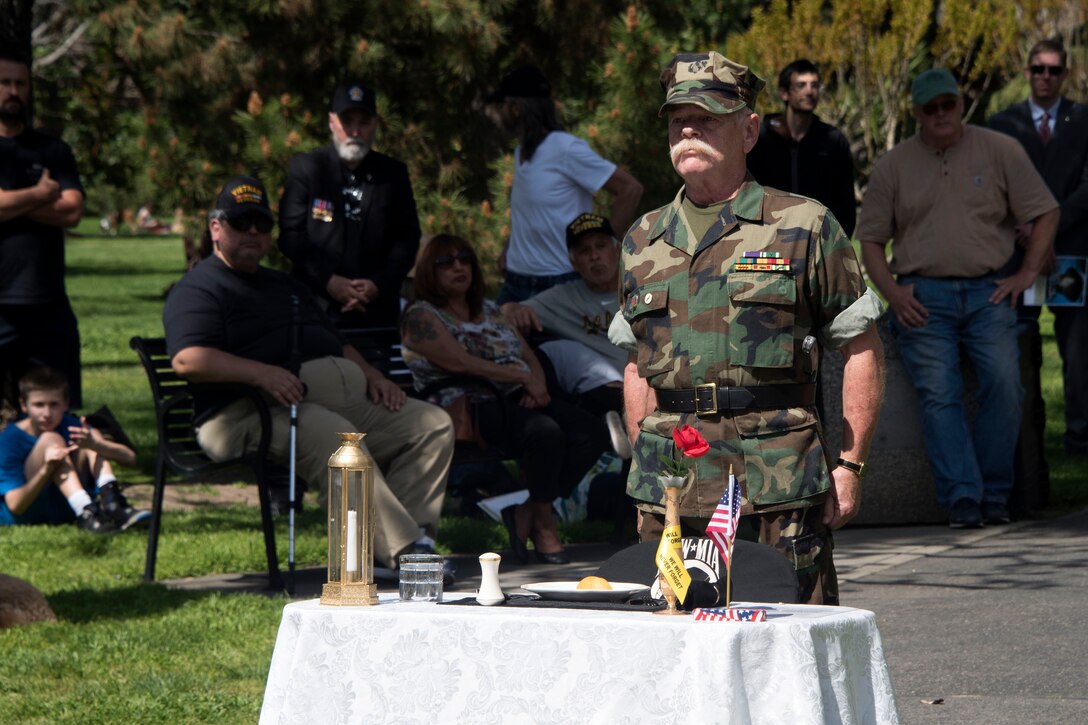 Veteran performs Prisoner of War/Missing in Action ceremony.