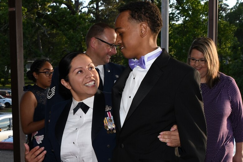 U.S. Air Force Master Sgt. Angelina Evans, a logistics manager assigned to 8th Air Force, Barksdale Air Force Base, Louisiana, escorts and attendee to the El Karubah Shriners’ Memories in Wonderland Ball, Shreveport, Louisiana, April 14, 2018.