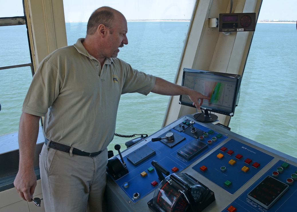 Dredge McFarland Captain Mitch Tillyard points to a survey of shoaled areas in the shipping channel that the vessel must clear. The McFarland, one of four ocean-going hopper dredges owned and operated by the U.S. Army Corps of Engineers, conducted urgent dredging in Morehead City, N.C. in March and April of 2018. The McFarland is based out of the USACE Philadelphia District