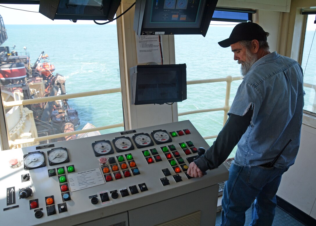 Dredge McFarland Marine machinery mechanic and drag tender Ray Bailey prepares to lower a drag arm. The McFarland, one of four ocean-going hopper dredges owned and operated by the U.S. Army Corps of Engineers, conducted urgent dredging in Morehead City, N.C. in March and April of 2018. The McFarland is based out of the USACE Philadelphia District.
