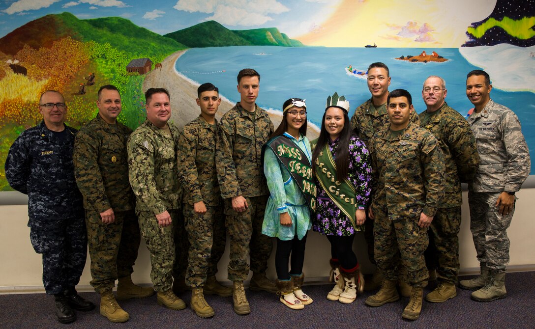 Service members supporting Innovative Readiness Training Arctic Care 2018 pose with Miss Teen Arctic Circle and Miss Arctic Circle, Kotzebue, Alaska, April 16, 2018.