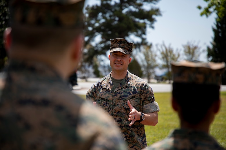 U.S. Marine Corps Col. David S. Owen, commanding officer of II Marine Expeditionary Force Information Group shakes hands with Marines with Food Service Company, II MEF Support Battalion, after being recognized as the best expeditionary food service in the Marine Corps at Camp Lejeune, N.C., April 13, 2018.