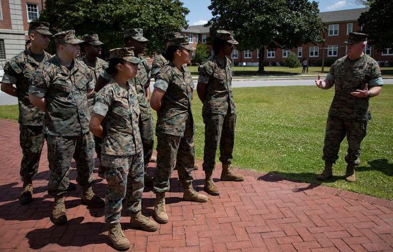 U.S. Marine Corps Col. David S. Owen, commanding officer of II Marine Expeditionary Force Information Group shakes hands with Marines with Food Service Company, II MEF Support Battalion, after being recognized as the best expeditionary food service in the Marine Corps at Camp Lejeune, N.C., April 13, 2018.