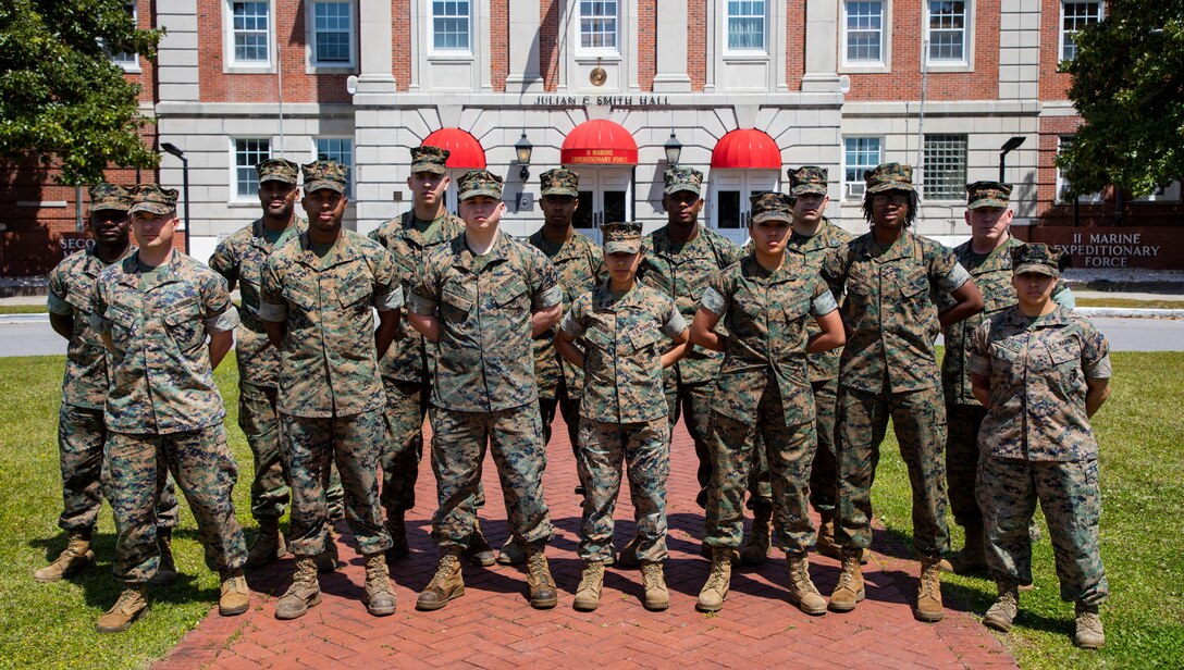 U.S. Marine Corps Col. David S. Owen, commanding officer of II Marine Expeditionary Force Information Group shakes hands with Marines with Food Service Company, II MEF Support Battalion, after being recognized as the best expeditionary food service in the Marine Corps at Camp Lejeune, N.C., April 13, 2018.