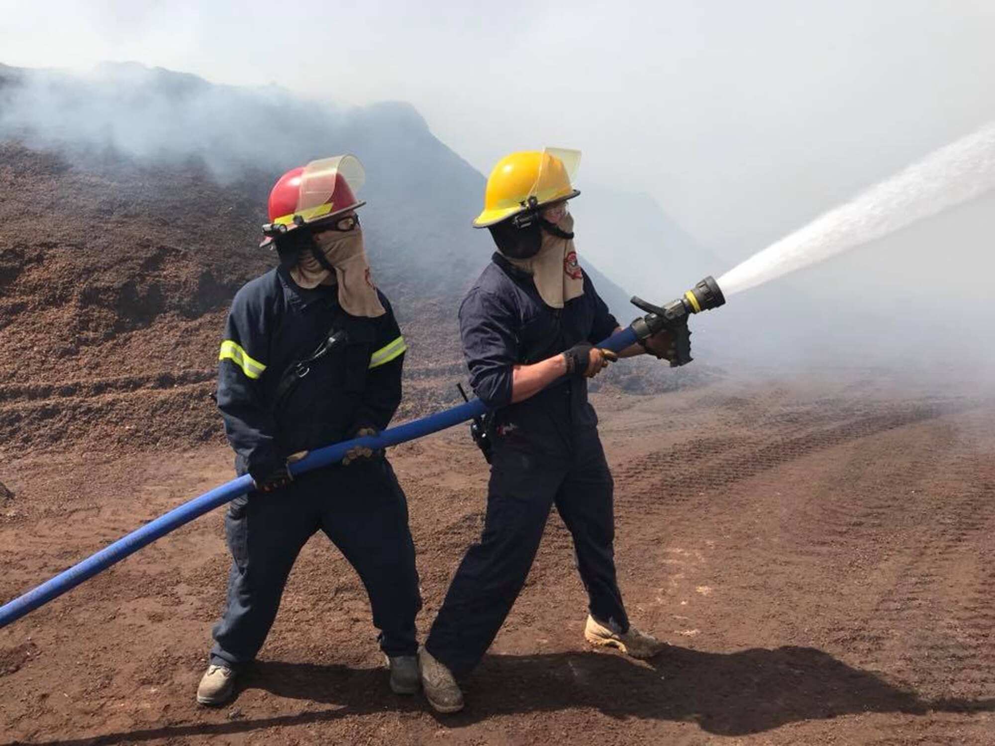 The Altus AFB Fire Emergency Flight, part of Jackson County Task Force, helps to contain fires at the Co-Op, April 13, 2018, near Altus, Okla.