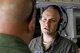 U.S. Air Force Maj. Christopher Schlener, a command post chief assigned to the 97th Air Mobility Wing, speaks with U.S. Col Eric Carney, commander of the 97th AMW, before a familiarization flight for the Altus Air Force Base Honorary Commanders, April 16, 2018, at Altus AFB, Okla.