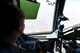 Loran Mayes, an executive director for the Armed Services YMCA, looks at the view over Texas from the cockpit of a C-17 Globemaster III, April 16, 2018, at Altus AFB, Okla.