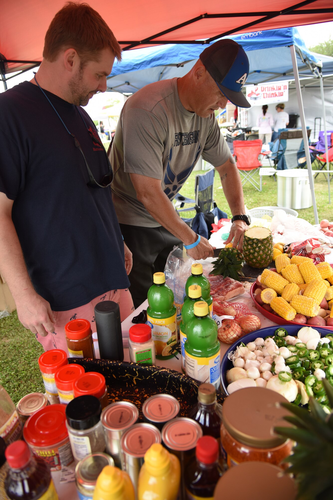 “First Sergeants Council” team members, Dustin Polovich and U.S. Air Force Master Sgt. Billy Dunn, 335th Training Squadron first sergeant, prepare the ‘fixins’ during the 6th Annual Bay Breeze Crawfish Cook-Off at the Bay Breeze Event Center at Keesler Air Force Base, Mississippi, April 13, 2018. The “Craw-Fish Pot-Nahs” won first place overall and a free entry into the 26th Annual Mississippi Coast Coliseum Crawfish Festival Cook-Off. Over 800 Keesler personnel attended the event and almost 1700 pounds of crawfish was distributed. (U.S. Air Force photo by Kemberly Groue)