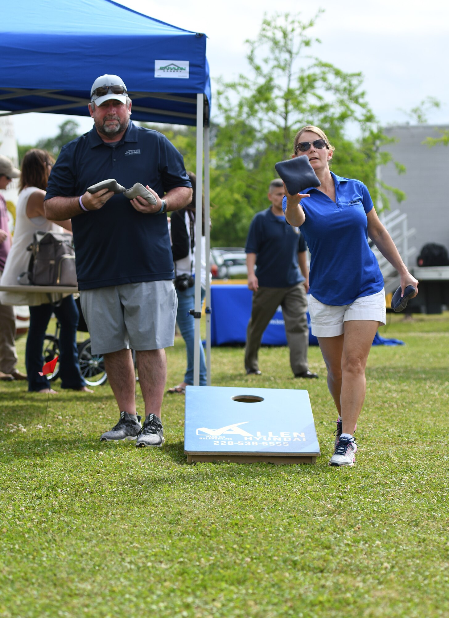 Michael Fix, 81st Force Support Squadron deputy director, and U.S. Air Force Lt. Col. Teresa Ammons, 81st FSS commander, play corn hole during the 6th Annual Bay Breeze Crawfish Cook-Off at the Bay Breeze Event Center at Keesler Air Force Base, Mississippi, April 13, 2018. The “Craw-Fish Pot-Nahs” won first place overall and a free entry into the 26th Annual Mississippi Coast Coliseum Crawfish Festival Cook-Off. Twenty-one teams competed in the event with over 800 Keesler personnel in attendance and almost 1700 pounds of crawfish distributed. (U.S. Air Force photo by Kemberly Groue)