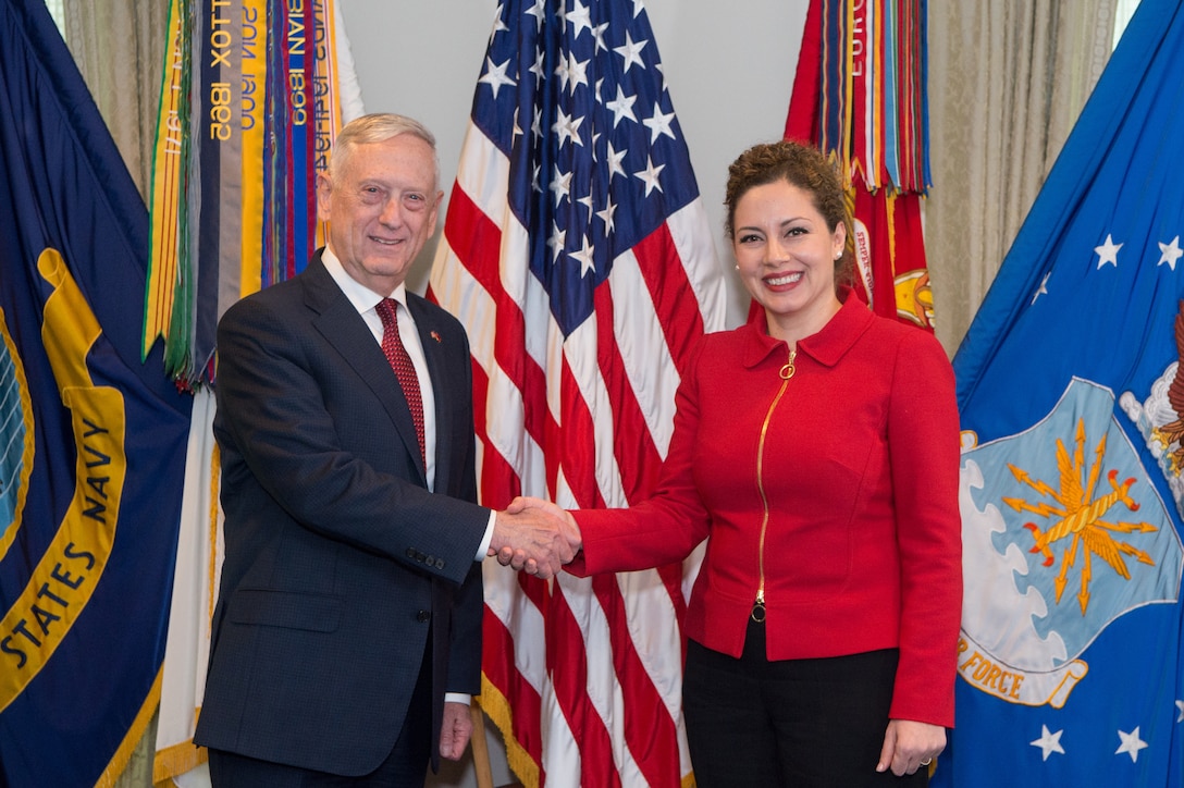 The U.S. and Albanian defense ministers shake hands.