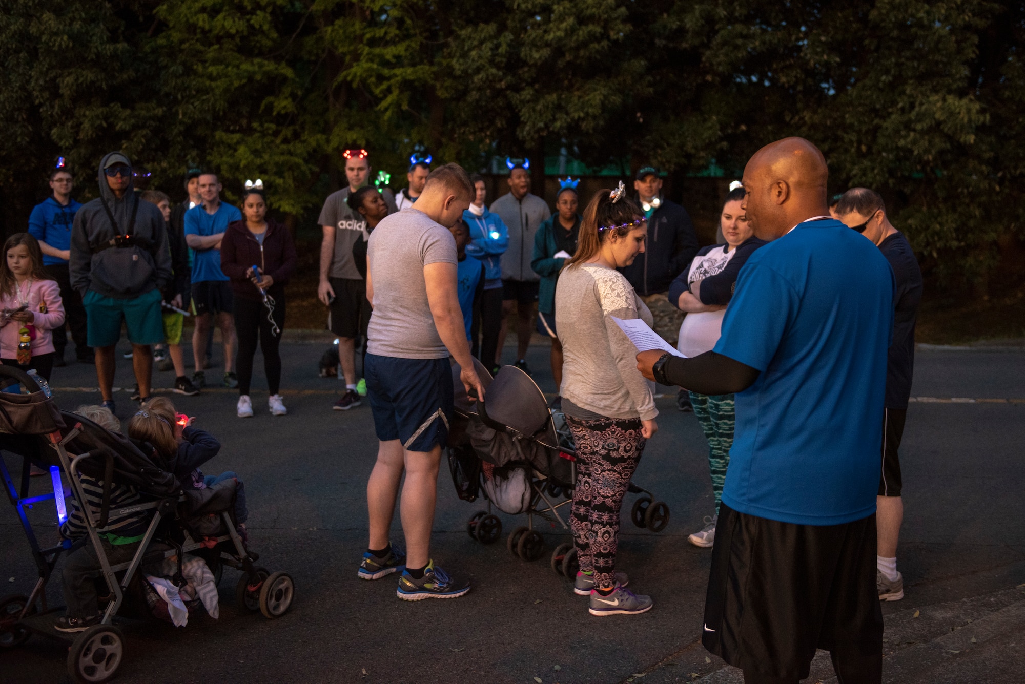 Chief Master Sgt. Elvin L. Young, 374th Airlift Wing command chief, takes a moment to speak about the importance of ending sexual assault prior to the Light the Night 5k at Yokota Air Base, Japan, April 13, 2018.