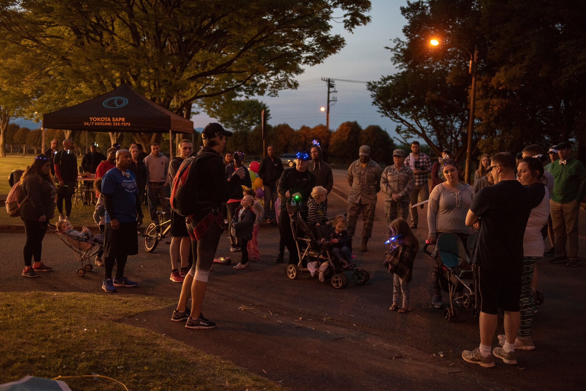 Maj. Donna Sickler, 374th Medical Group group practice manager and alternate sexual assault response coordinator, shares her story with those in attendance at the Light the Night 5k at Yokota Air Base, Japan, April 13, 2018.