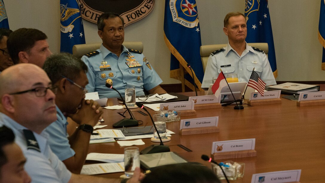 Indonesian Air Vice Marshal Umar Sugeng Haryono (left) and U.S. Air Force Maj. Gen. Russell Mack (Right) Pacific Air Forces (PACAF) deputy commander, receive a briefing during the Airman-to-Airman (A2A) talks with Indonesia at Joint Base Pearl Harbor-Hickam, Hawaii, April 11, 2018. PACAF senior leaders hosted Indonesian air force leaders to discuss common regional security challenges. The A2A talks are intended to increase cooperation with our allies and partners. (U.S. Air Force Photo/Staff Sgt. Daniel Robles)