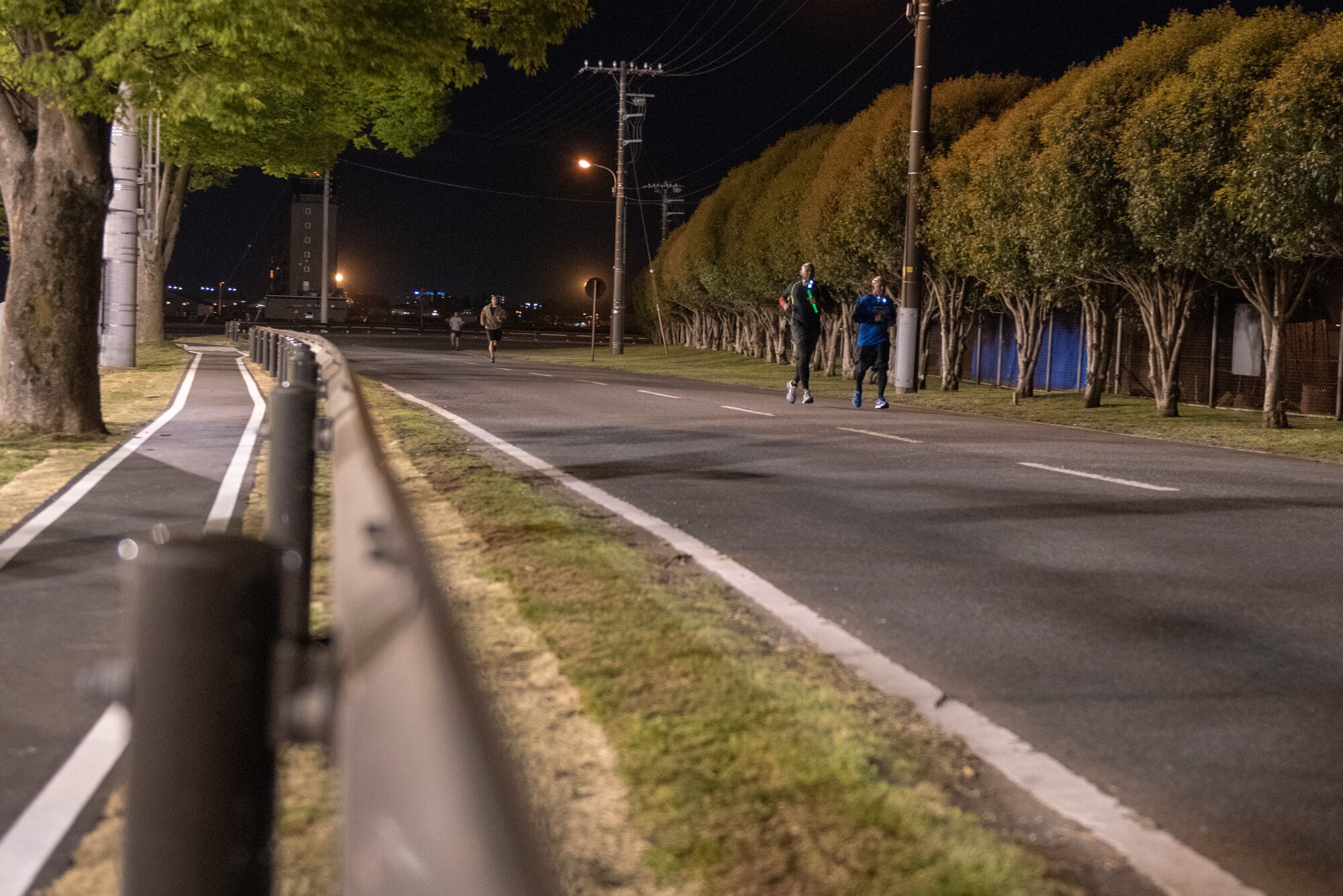 Participants in the Light the Night 5k sprint to the finish line at Yokota Air Base, Japan, April 13, 2018.