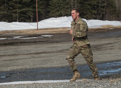 Spc. Eric Haugh, a sniper assigned to the 1st Squadron, 40th Cavalry Regiment (Airborne), 4th Infantry Brigade Combat Team (Airborne), 25th Infantry Division, U.S. Army Alaska, sprints during a stress shooting exercise at Joint Base Elmendorf-Richardson, Alaska, April 11, 2018. Leadership at Forward Operating Base Gardez, Afghanistan, hand-picked Haugh to represent the U.S. in the 10th Annual Czech Republic World Sniper Competition April 23 through 27. Stress shooting drills incorporate physical training to increase heart rate and breathing and make holding steady difficult during shooting, simulating a stressed environment.