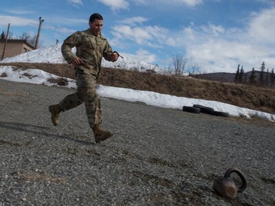 Spc. Arturo Dominguez, a sniper assigned to the 1st Squadron, 40th Cavalry Regiment (Airborne), 4th Infantry Brigade Combat Team (Airborne), 25th Infantry Division, U.S. Army Alaska, sprints during a stress shooting exercise at Joint Base Elmendorf-Richardson, Alaska, April 11, 2018. Leadership at Forward Operating Base Gardez, Afghanistan, hand-picked Dominguez to represent the U.S. in the 10th Annual Czech Republic World Sniper Competition April 23 through 27. Stress shooting drills incorporate physical training to increase heart rate and breathing and make holding steady difficult during shooting, simulating a stressed environment.