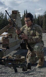 Spc. Arturo Dominguez, a sniper assigned to the 1st Squadron, 40th Cavalry Regiment (Airborne), 4th Infantry Brigade Combat Team (Airborne), 25th Infantry Division, U.S. Army Alaska, loads a magazine of ammunition into his M110 Semi-Automatic Sniper System during a stress shooting exercise at Joint Base Elmendorf-Richardson, Alaska, April 11, 2018. Leadership at Forward Operating Base Gardez, Afghanistan, hand-picked Dominguez to represent the U.S. in the 10th Annual Czech Republic World Sniper Competition April 23 through 27. Stress shooting drills incorporate physical training to increase heart rate and breathing and make holding steady difficult during shooting, simulating a stressed environment.
