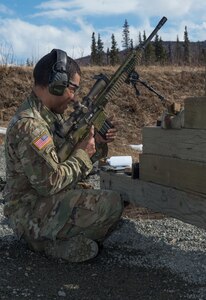 Spc. Arturo Dominguez, a sniper assigned to the 1st Squadron, 40th Cavalry Regiment (Airborne), 4th Infantry Brigade Combat Team (Airborne), 25th Infantry Division, U.S. Army Alaska, loads a magazine of ammunition into his M110 Semi-Automatic Sniper System during a stress shooting exercise at Joint Base Elmendorf-Richardson, Alaska, April 11, 2018. Leadership at Forward Operating Base Gardez, Afghanistan, hand-picked Dominguez to represent the U.S. in the 10th Annual Czech Republic World Sniper Competition April 23 through 27. Stress shooting drills incorporate physical training to increase heart rate and breathing and make holding steady difficult during shooting, simulating a stressed environment.