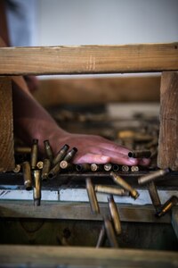 Spc. Eric Haugh, a sniper assigned to Charlie Troop, 1st Squadron, 40th Cavalry Regiment (Airborne), 4th Infantry Brigade Combat Team (Airborne), 25th Infantry Division, U.S. Army Alaska, accounts for empty casings at Joint Base Elmendorf-Richardson, Alaska, April 11, 2018, during marksmanship training. A sniper's main responsibility is to deliver discriminatory, highly accurate rifle fire against enemy targets that cannot be engaged successfully by the regular rifleman due to range, size, location, fleeting nature, or visibility.