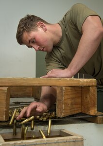 Spc. Eric Haugh, a sniper assigned to Charlie Troop, 1st Squadron, 40th Cavalry Regiment (Airborne), 4th Infantry Brigade Combat Team (Airborne), 25th Infantry Division, U.S. Army Alaska, accounts for empty casings at Joint Base Elmendorf-Richardson, Alaska, April 11, 2018, during marksmanship training. A sniper's main responsibility is to deliver discriminatory, highly accurate rifle fire against enemy targets that cannot be engaged successfully by the regular rifleman due to range, size, location, fleeting nature, or visibility.