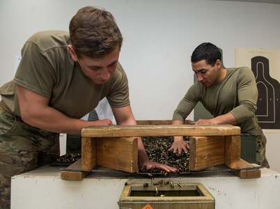 Specialists Arturo Dominguez and Eric Haugh, snipers assigned to the 1st Squadron, 40th Cavalry Regiment (Airborne), 4th Infantry Brigade Combat Team (Airborne), 25th Infantry Division, U.S. Army Alaska, account for empty shells at Joint Base Elmendorf-Richardson, Alaska, April 11, 2018, during marksmanship training. A sniper's main responsibility is to deliver discriminatory, highly accurate rifle fire against enemy targets that cannot be engaged successfully by the regular rifleman due to range, size, location, fleeting nature, or visibility.