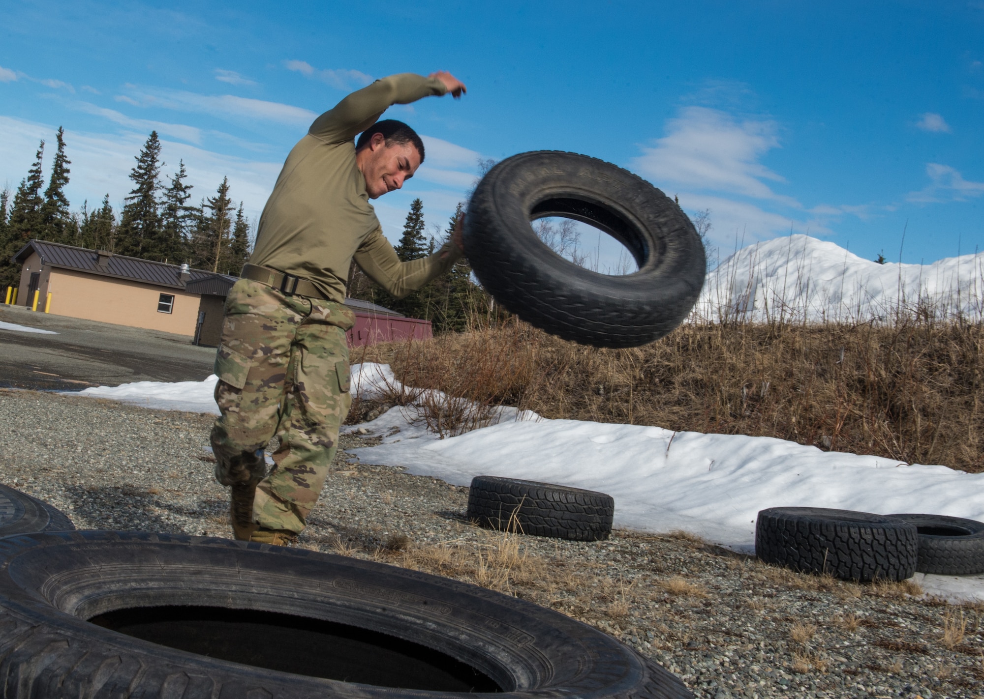 Spc. Eric Haugh, a sniper assigned to the 1st Squadron, 40th Cavalry Regiment (Airborne), 4th Infantry Brigade Combat Team (Airborne), 25th Infantry Division, U.S. Army Alaska, sprints with kettle bells during a stress shooting exercise at Joint Base Elmendorf-Richardson, Alaska, April 11, 2018. Leadership at Forward Operating Base Gardez, Afghanistan, hand-picked Haugh to represent the U.S. in the 10th Annual Czech Republic World Sniper Competition April 23 through 27. Stress shooting drills incorporate physical training to increase heart rate and breathing and make holding steady difficult during shooting, simulating a stressed environment.
