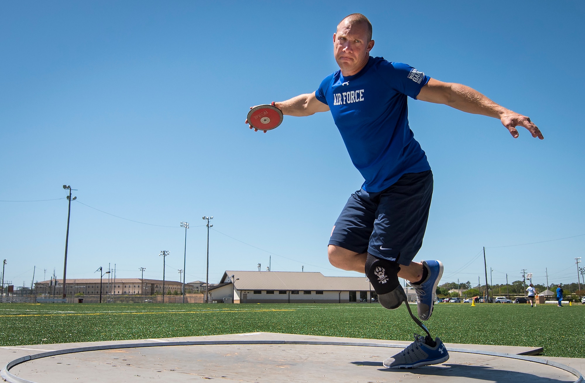 Ben Seekell, a Warrior Games athlete, goes into his discus rotation during a track and field session at the U.S. Air Force team’s training camp at Eglin Air Force Base, Fla., April 16, 2018. The base-hosted, week-long Warrior Games training camp is the last team practice session before the yearly competition in June. (U.S. Air Force photo by Samuel King Jr.)