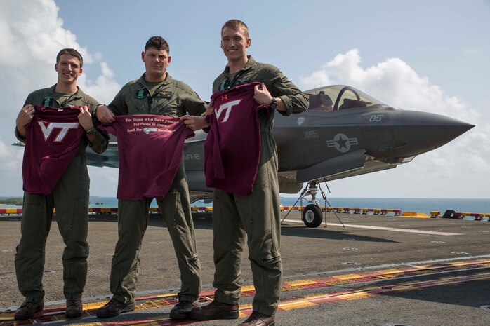 (From left to right) Capt. Evan Slusser, Maj. John Stuart and Capt. Andrew Thornberg are F-35B Lightning II pilots with Marine Fighter Attack Squadron 121, 31st Marine Expeditionary Unit, currently embarked aboard the USS Wasp (LHD-1).