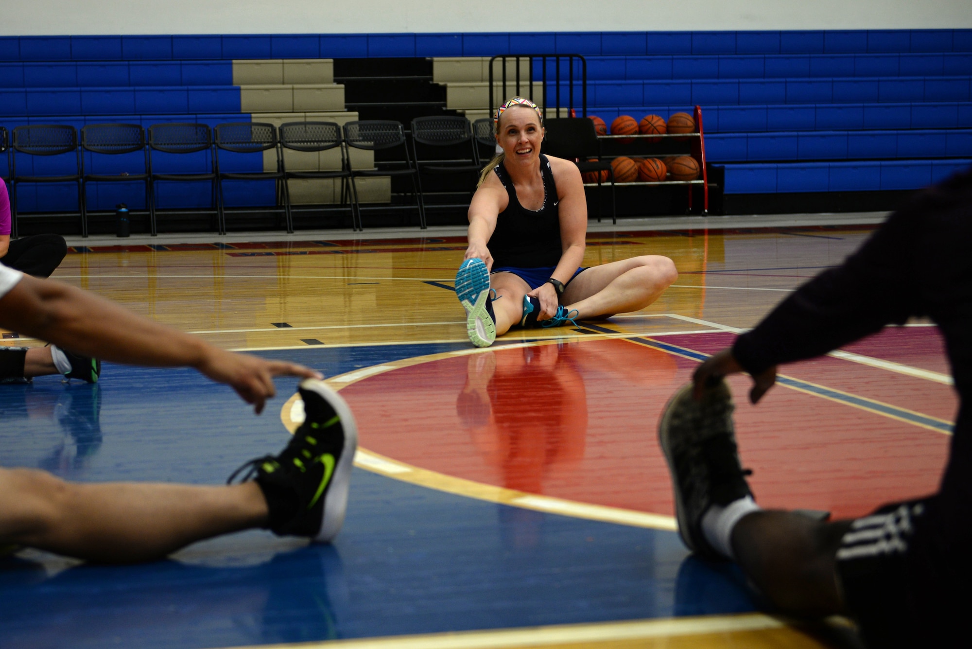 Maj. Elizabeth Liebner, 36th MDOS Physical Therapy Officer, stretches with a runner's clinic class after a work-out March 21, 2018, at Andersen Air Force Base, Guam. The Andersen Physical Therapy team is implementing a new running clinic to teach and improve active duty service members running abilities April 19 at 1500, held in the Coral Reef Fitness Center basketball courts. (U.S. Air Force photo by Senior Airman Alexa Ann Henderson)