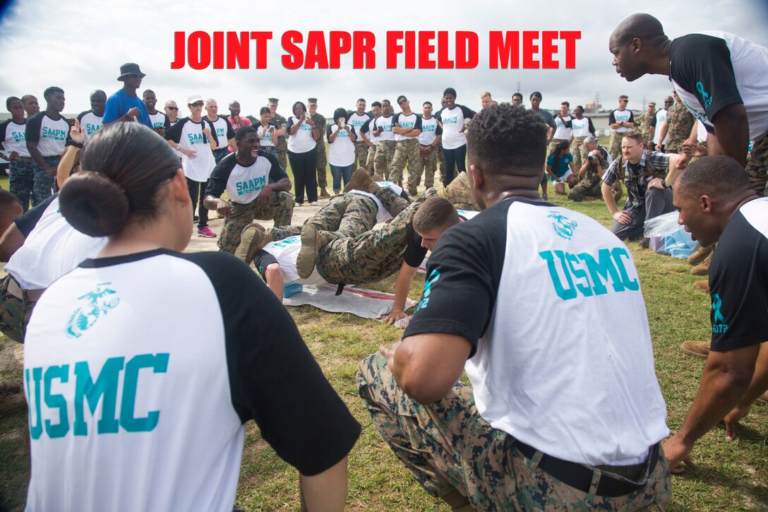Marine Corps Installations Pacific, III Marine Expeditionary Force, 3rd Marine Logistics Group and 3rd Marine Division U.S. Marines compete in a timed four-man push-up contest at the 3rd Annual Sexual Assault Awareness and Prevention Month Field Meet April 13, 2018, at Camp Foster, Okinawa, Japan. The Single Marine Program provided music and the Firefighters Association made breakfast and lunch for the Marines, Sailors, Airmen and Soldiers participating in the field meet. III Marine Expeditionary Force hosted this year’s joint service event to raise awareness throughout the branches about sexual assault and to build a sense of unity through competition. (U.S. Marine Corps photo by Lance Cpl. Isabella Ortega)