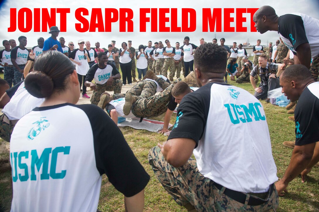 Marine Corps Installations Pacific, III Marine Expeditionary Force, 3rd Marine Logistics Group and 3rd Marine Division U.S. Marines compete in a timed four-man push-up contest at the 3rd Annual Sexual Assault Awareness and Prevention Month Field Meet April 13, 2018, at Camp Foster, Okinawa, Japan. The Single Marine Program provided music and the Firefighters Association made breakfast and lunch for the Marines, Sailors, Airmen and Soldiers participating in the field meet. III Marine Expeditionary Force hosted this year’s joint service event to raise awareness throughout the branches about sexual assault and to build a sense of unity through competition. (U.S. Marine Corps photo by Lance Cpl. Isabella Ortega)