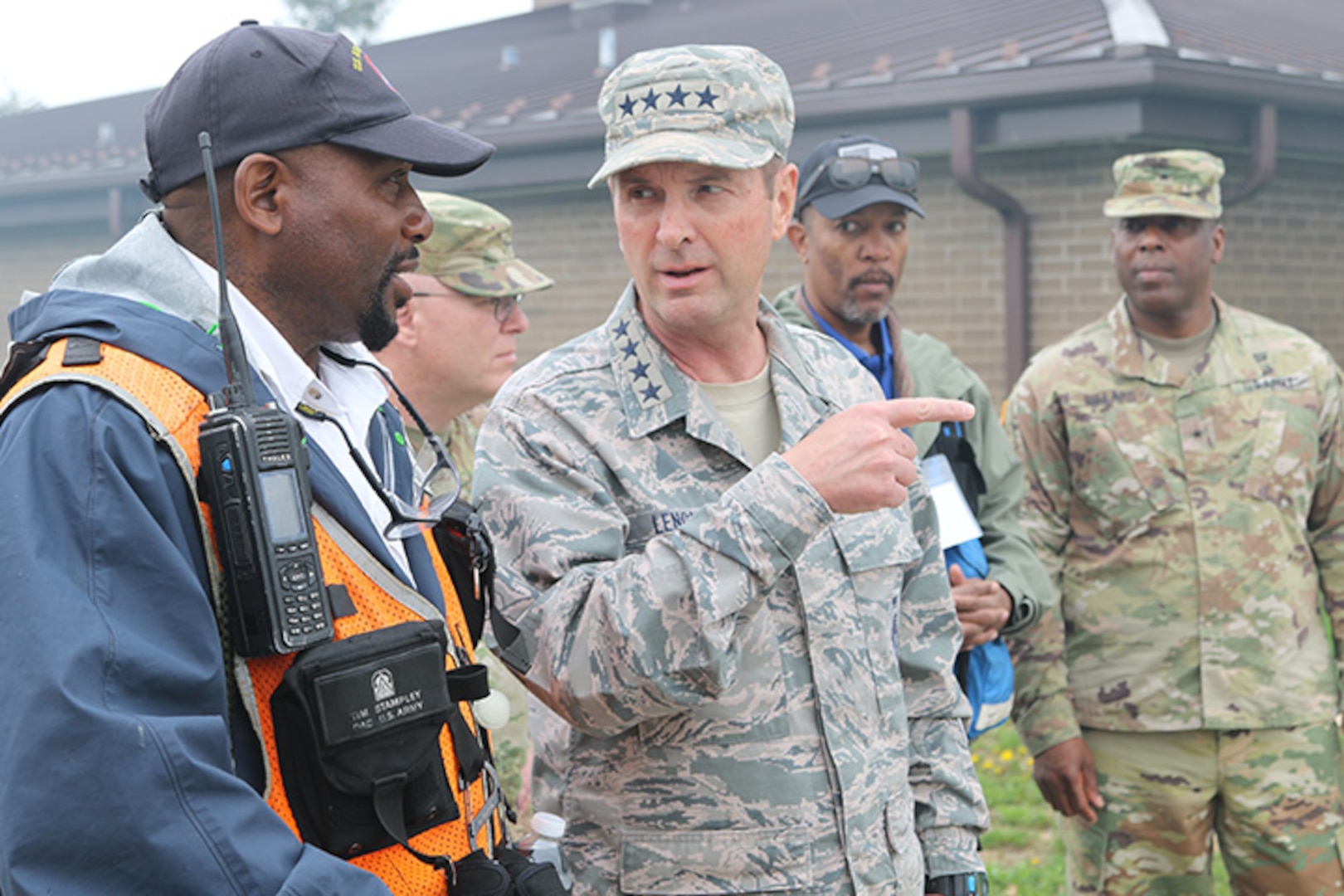 Tim Stampley, a Department of the Army Civilian observer controller trainer, and his crew, speaks to Gen. Joseph L. Lengyel, Chief of the National Guard Bureau, and gives him a tour of the training during Guardian Response 18 at Muscatatuck Urban Training Center, Ind., April 14, 2018.