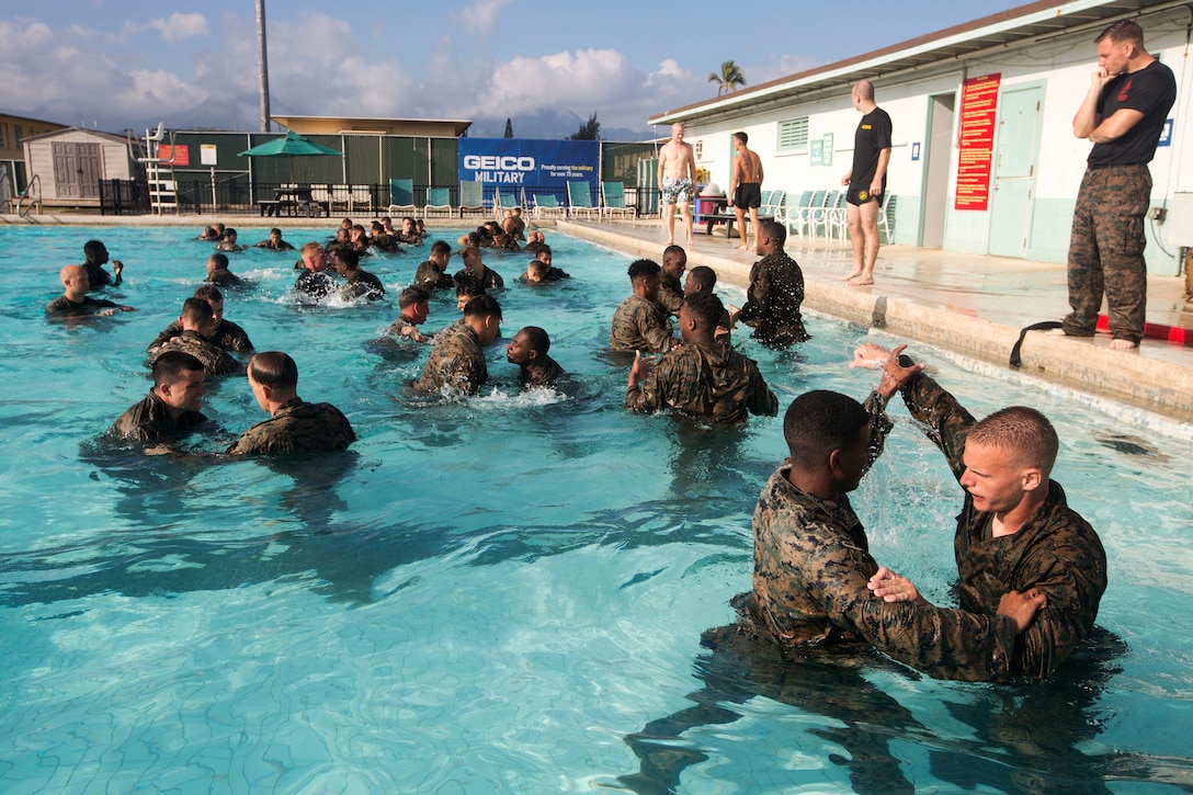 Marines learn grappling techniques.