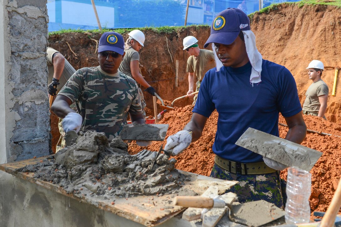 Sri Lankan soldiers continue work on engineering project.