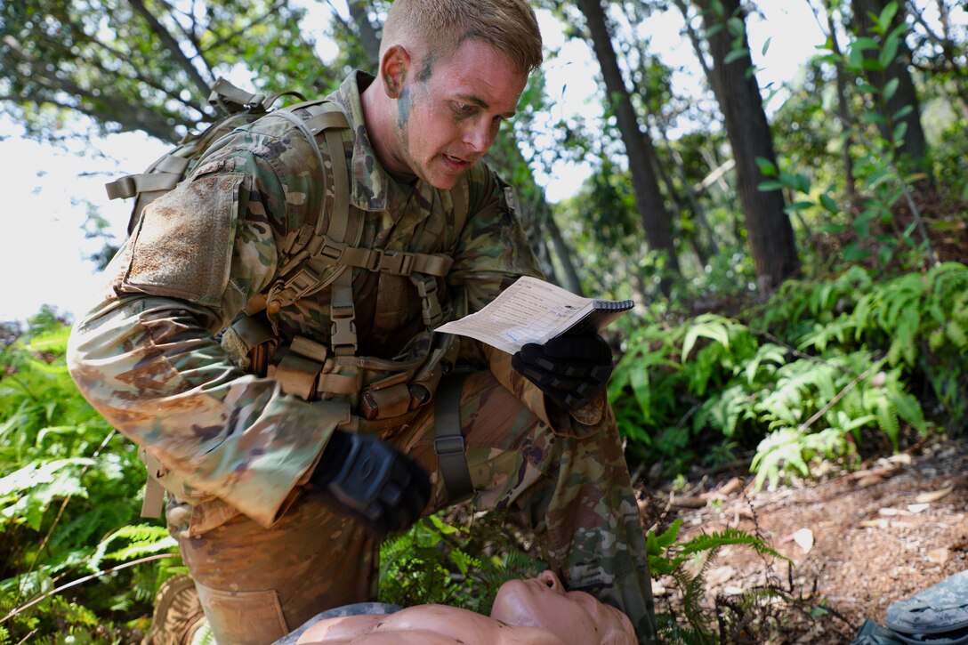 A soldier reads instructions for the next maneuver.