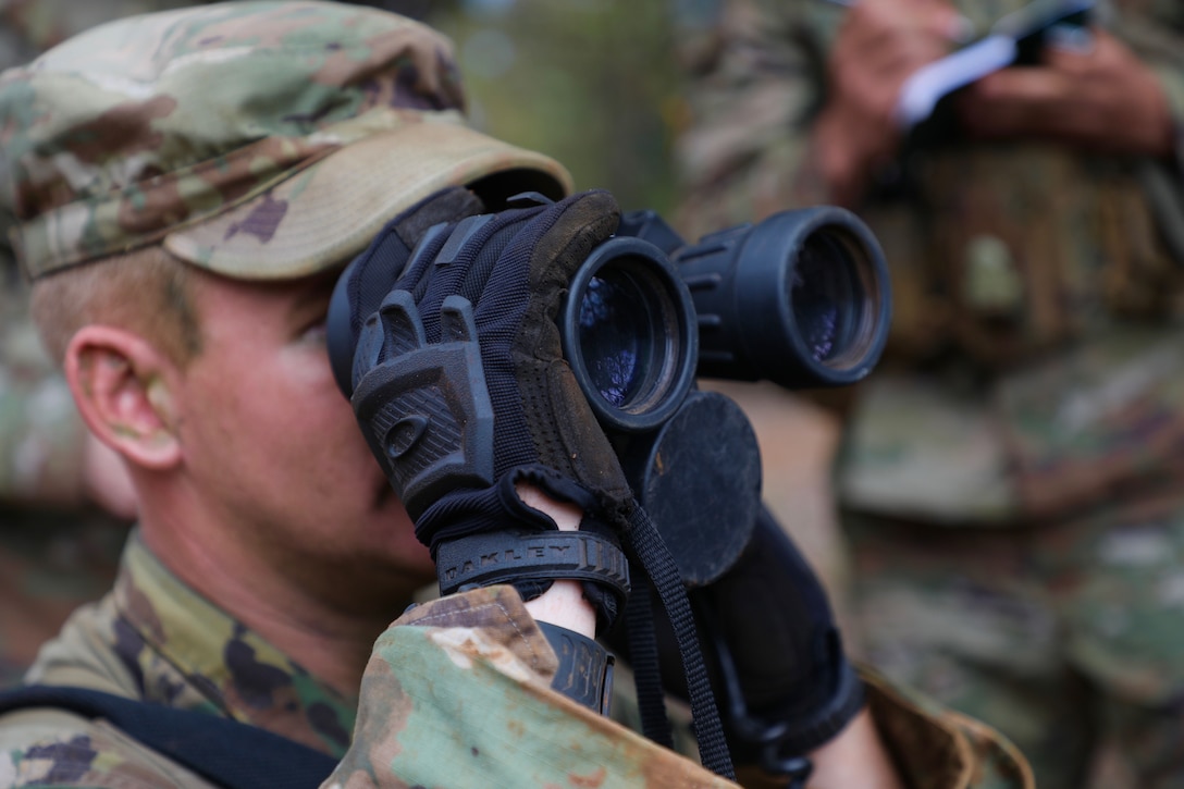 A soldier scans the area during the warrior competition.