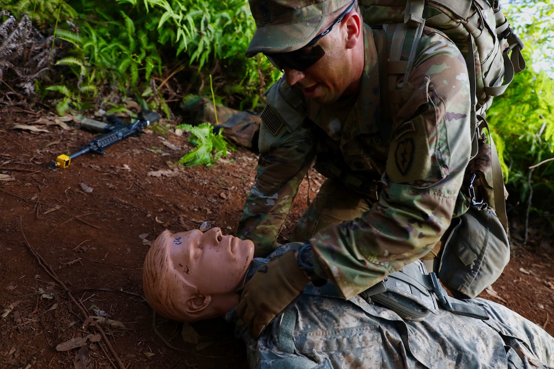 A soldier uses a mannequin during battle drills.